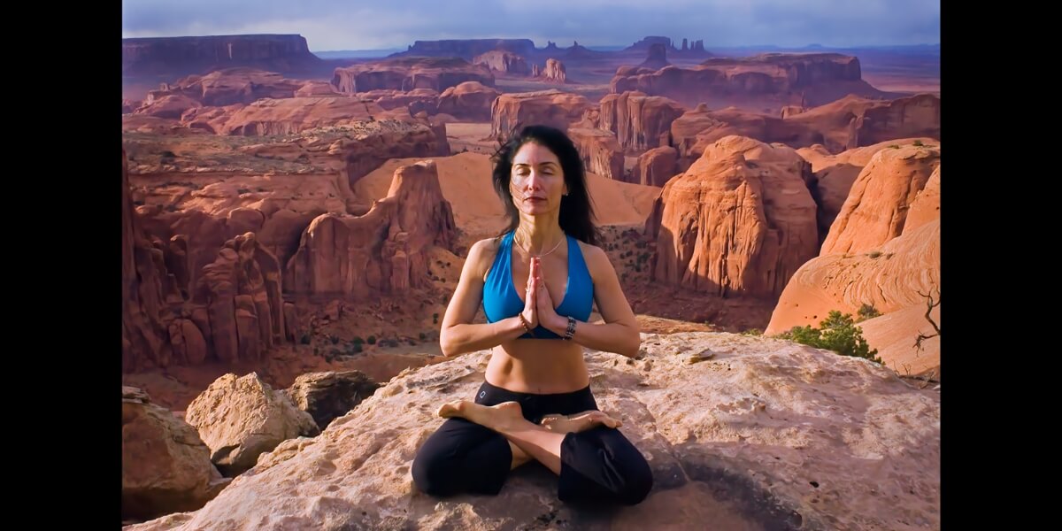 Jeannine doing Yoga above Monument Valley